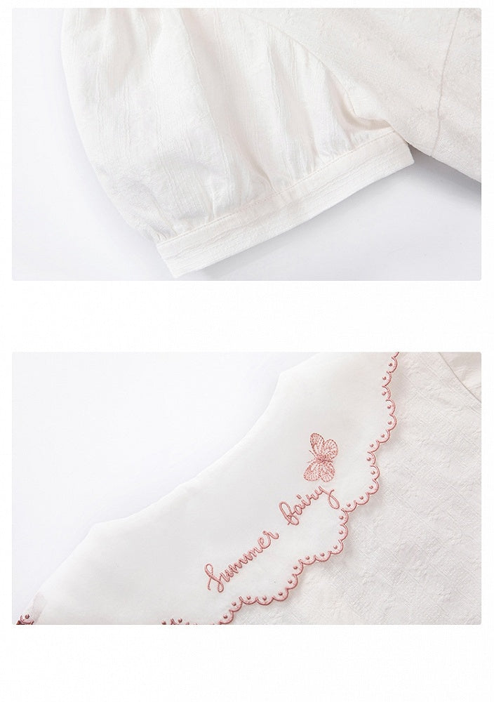 Rosa Bluse mit Schleifenbesatz und weißen Kurzarm