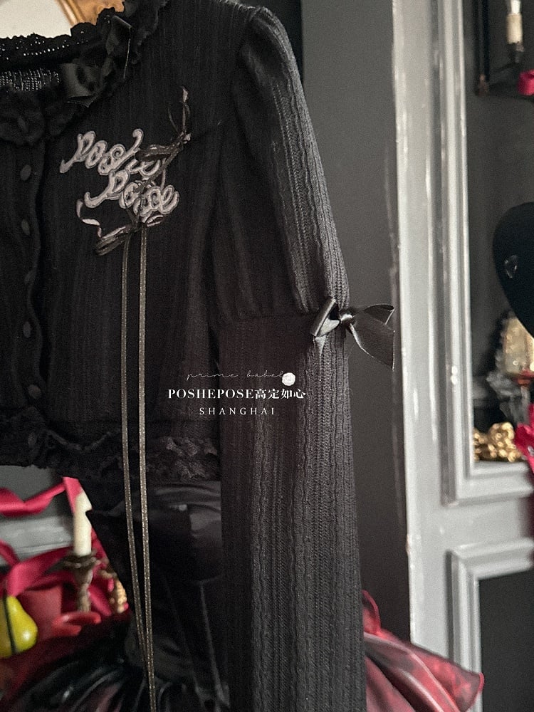 Schwarzes, langärmliges Strickoberteil mit Stickerei