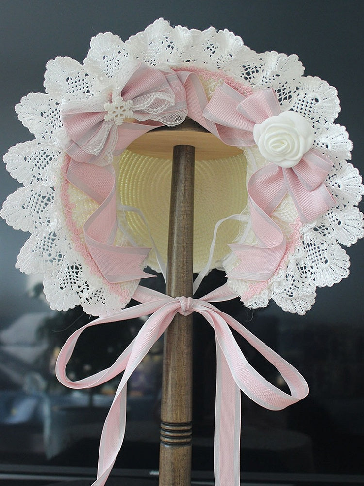 ピンク/ブルーの花柄リボンディテール、レーストリムのボンネット