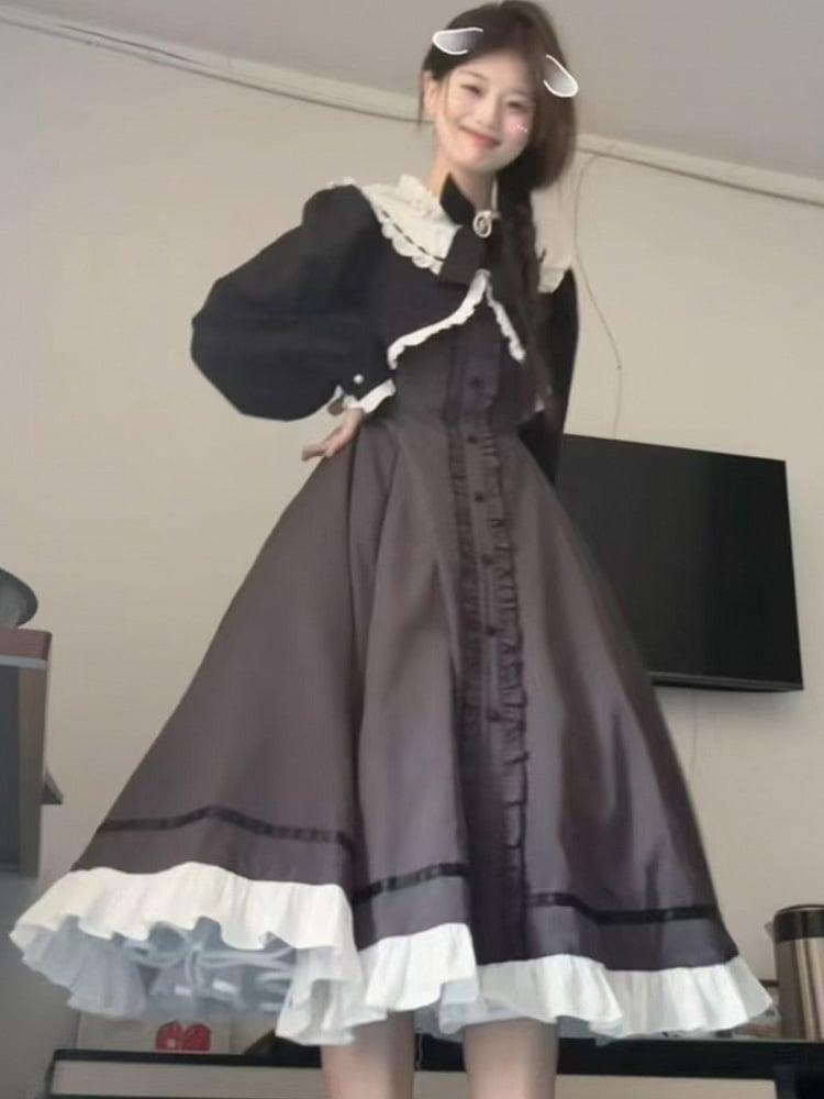 グレーブラックのフリルネックラインフェイクツーピースドレス