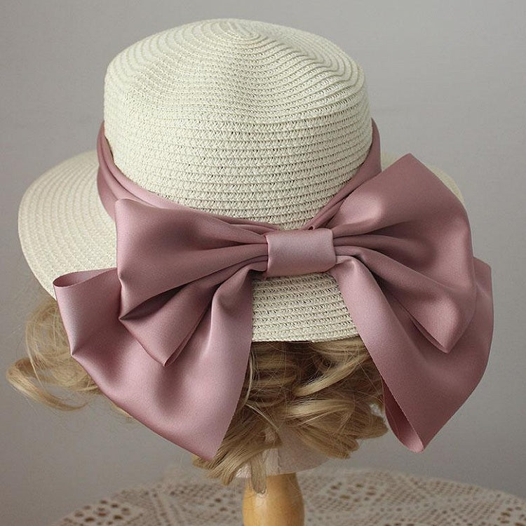 Strohhut mit großer Schleife