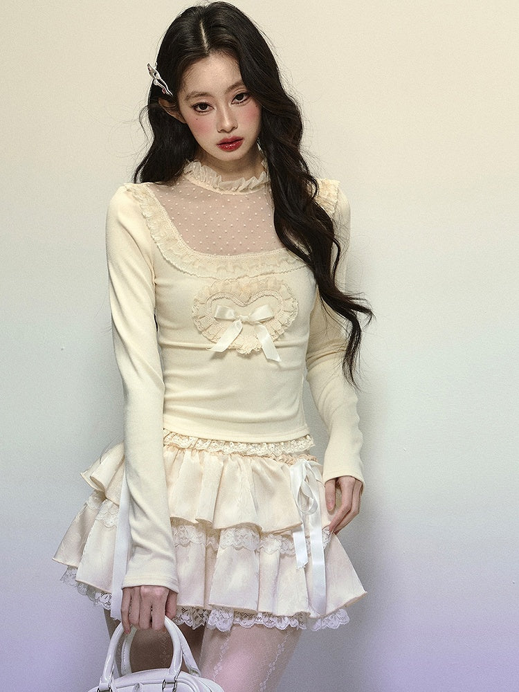 Aprikosenfarbenes Oberteil mit Illusionsausschnitt und Spitzenakzenten und langen Ärmeln