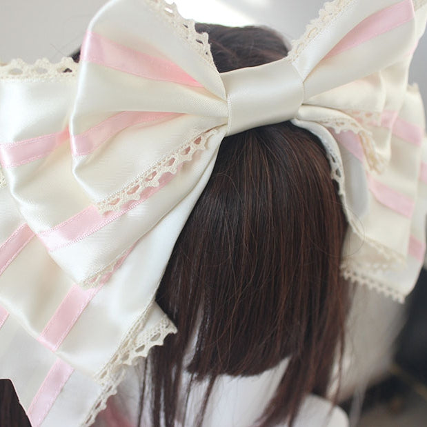 ピンクと白のストライプ柄の大きなリボンKC