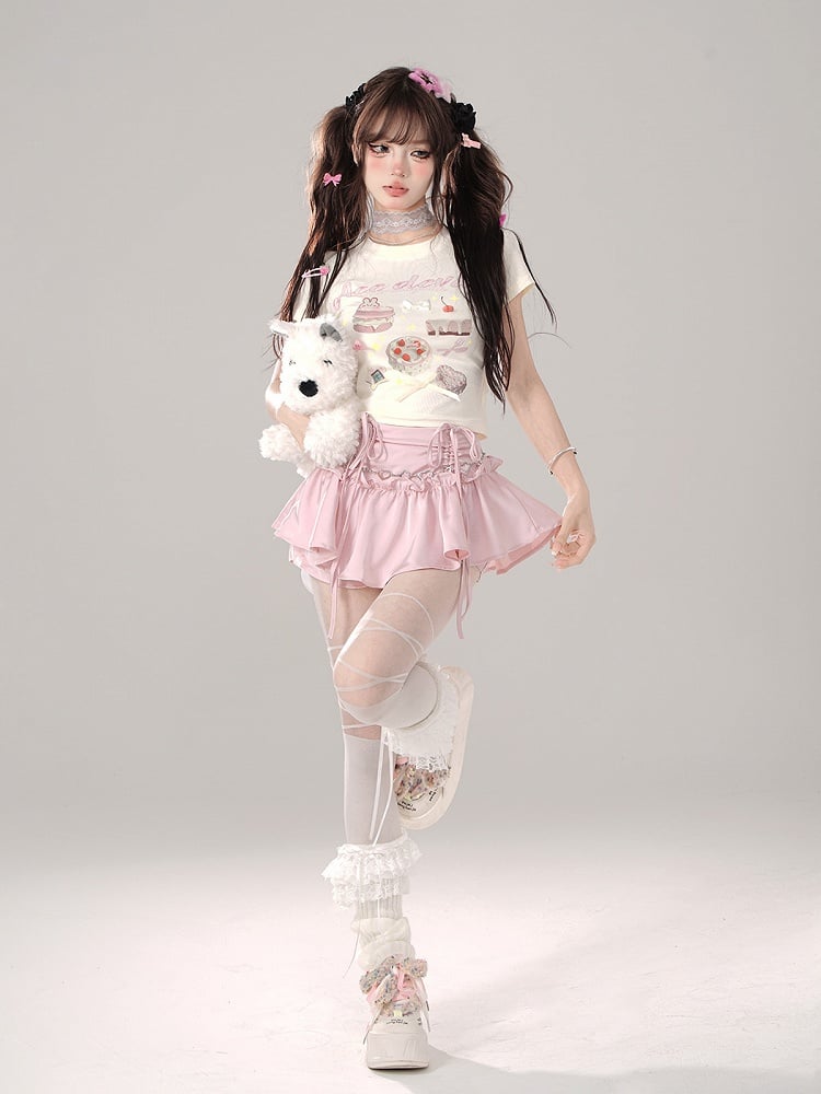 Tailliertes T-Shirt mit Schleife und Aprikosen-Süßigkeiten-Grafik