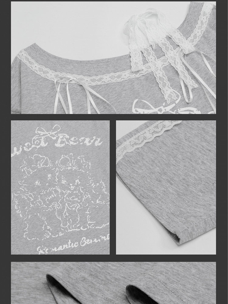 Graues Top mit asymmetrischem Ausschnitt und Cartoon-Spitzenakzenten