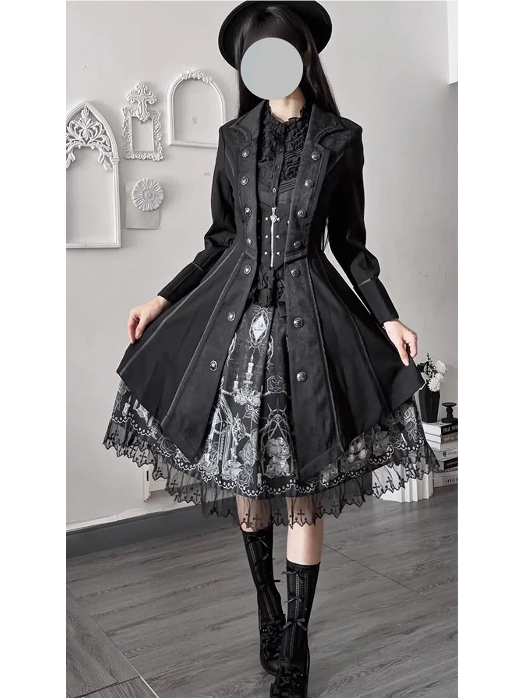 Flared hem of the black Gothic long coat held open