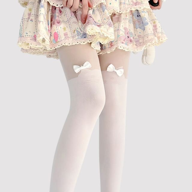 Transparente Strumpfhose mit Katzenmuster und Schleife