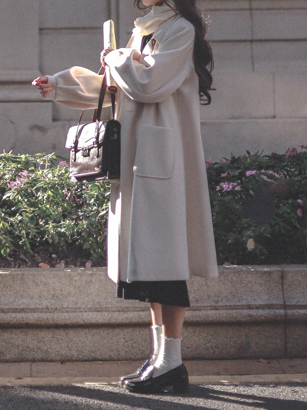 Zweireihiger Reverskragen mit langem Wollmantel in Weiß