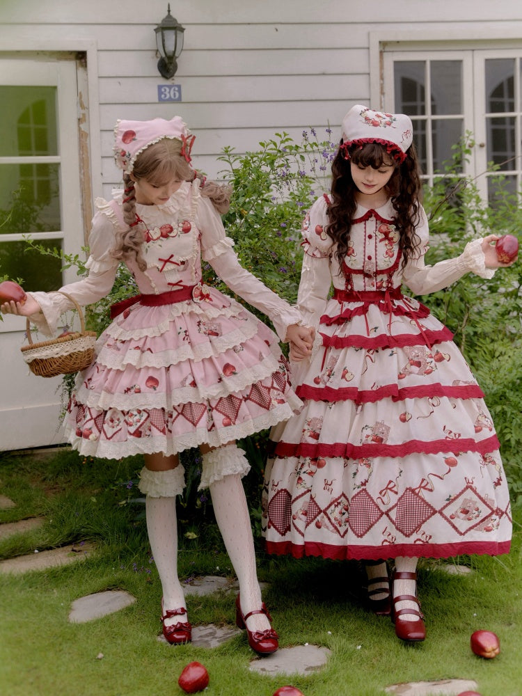 ピンクと赤のリンゴ柄の三角スカーフ