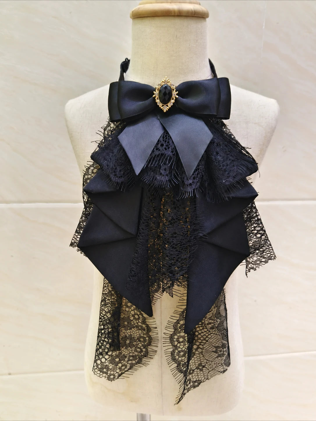 Black lace bow neck accessory with decorative jewel