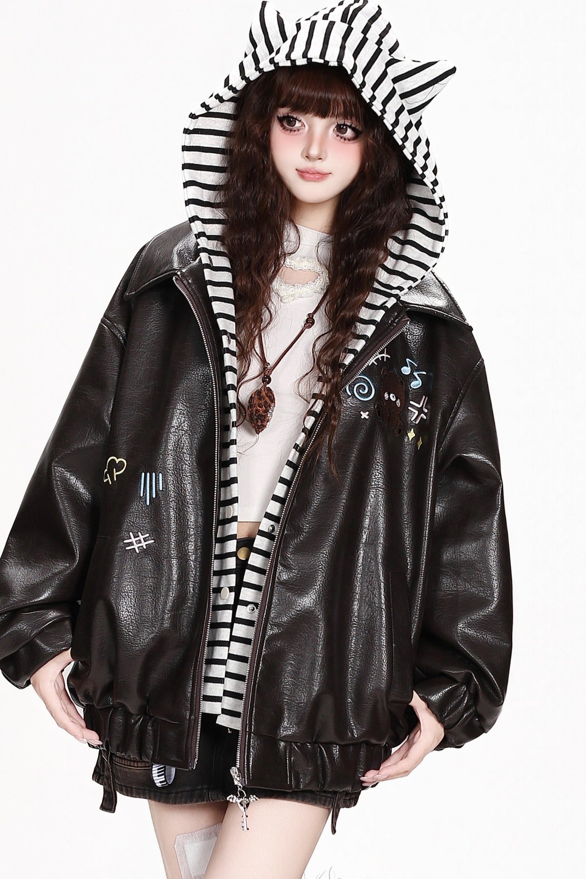 Deep brown faux-leather jacket with striped cat-ear hood