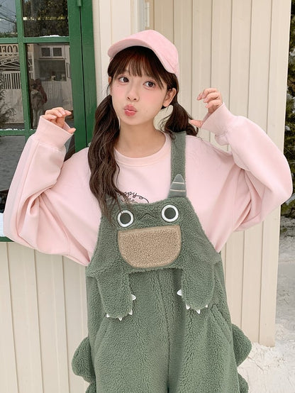 かわいい恐竜の緑のぬいぐるみオーバーオール