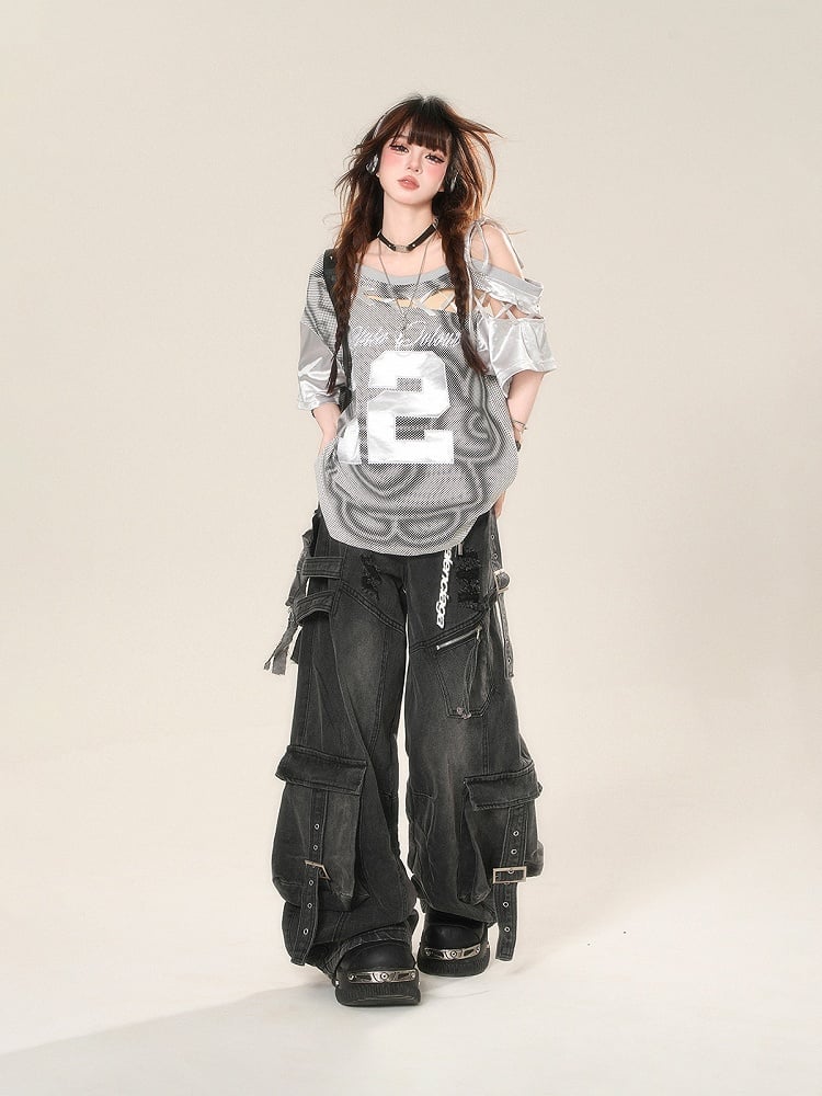 Schwarze Distressed-Jeans mit weitem Bein und Löchern, Schnalle, Cargotaschen und Riemen