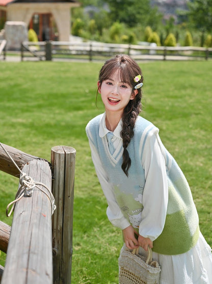 ブルー＆グリーングラデーションの子犬柄ニットベスト