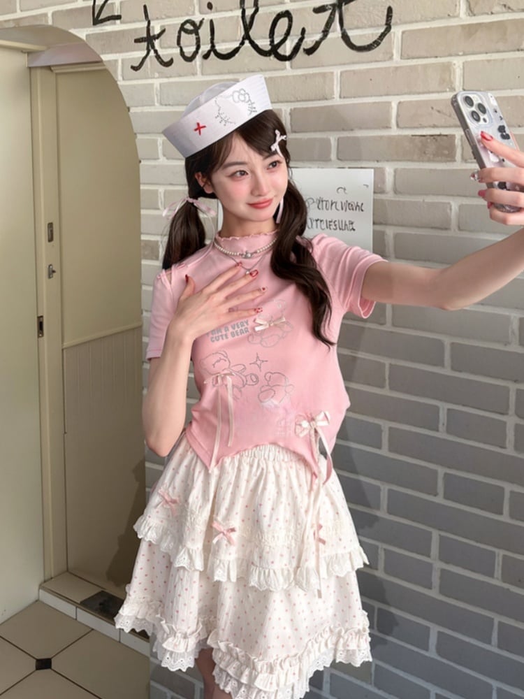 T-Shirt-Saum, gebogen, rosa Rüschen-Ausschnitt, Teddybär-Strasssteine, Schleifen-Akzente