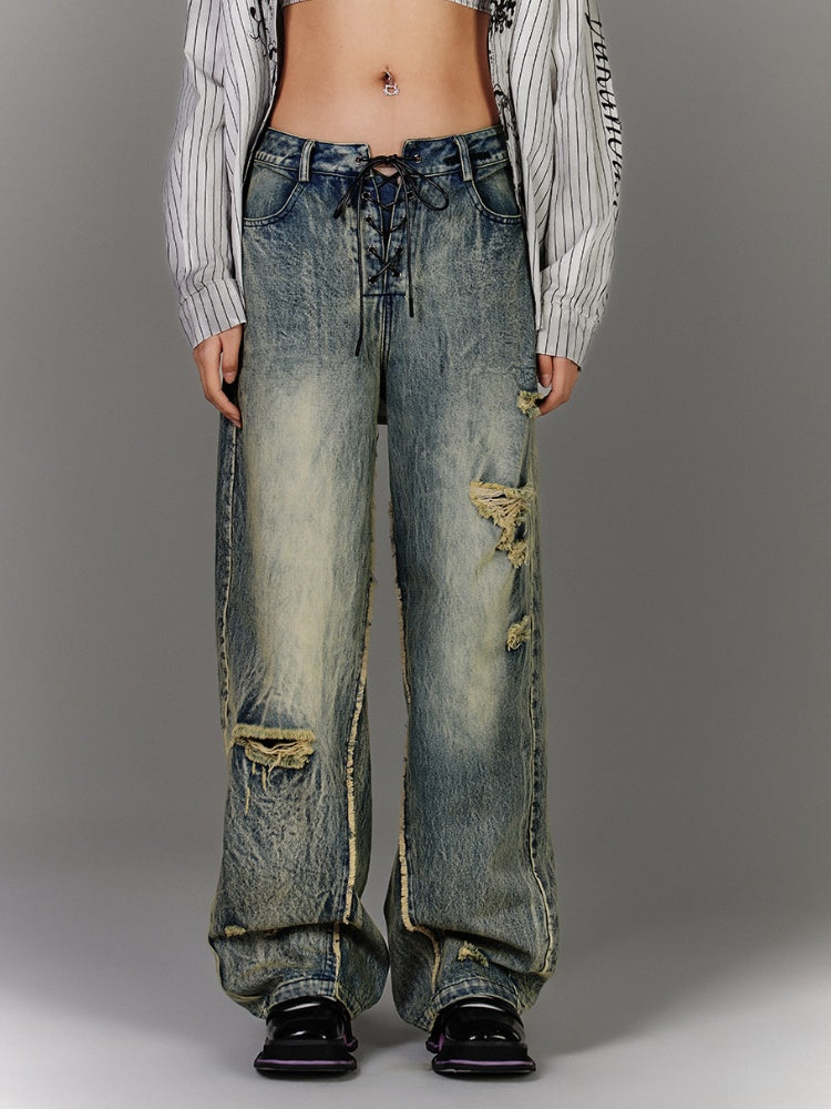 Blaue Vintage-Jeans mit tiefem Bein und Schnürung in der Taille, verblasste Waschung, Distressed-Löcher