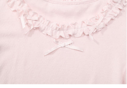Rosafarbenes, langärmliges Oberteil mit Rüschenbesatz und Schleifendetails