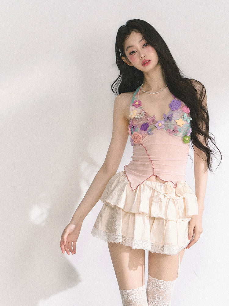 花柄装飾のピンクのレタス裾トップス ニット ホルターネック