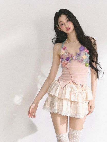 花柄装飾のピンクのレタス裾トップス ニット ホルターネック