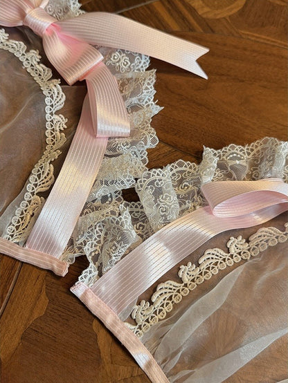 Verzierte blaue Auflage / Schleifenband rosa