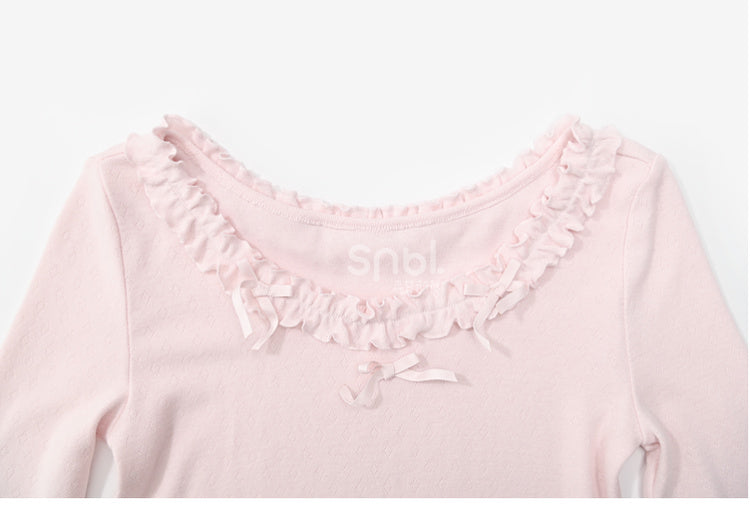 Rosafarbenes, langärmliges Oberteil mit Rüschenbesatz und Schleifendetails