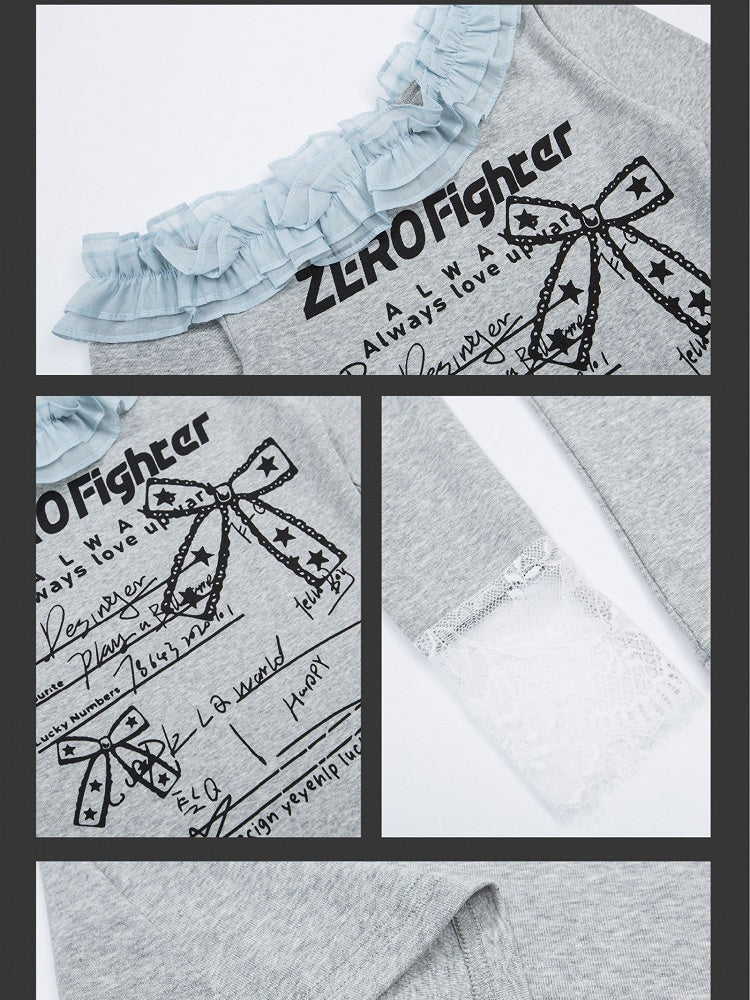 Graues Oberteil mit Buchstaben und asymmetrischem Ausschnitt und Spitzenmanschetten