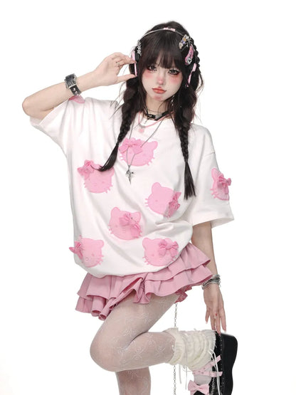 白/ピンクの蝶結びTシャツ柄 かわいい子猫