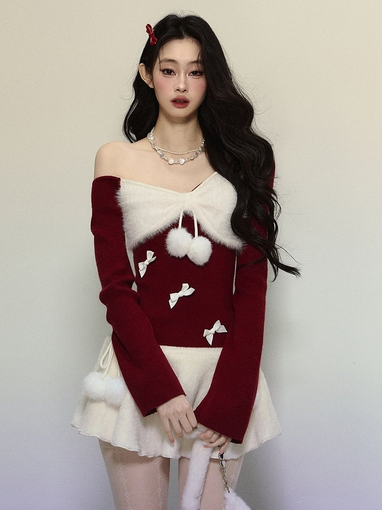 Strickoberteil mit asymmetrischem Ausschnitt und roter Schleife