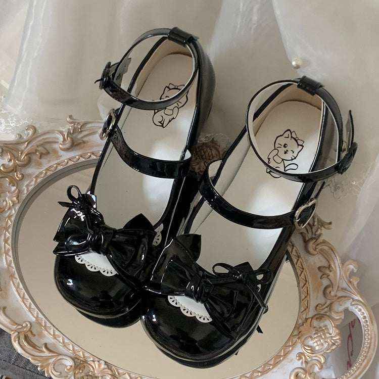 Low-heel Polished White Sweet Lolita Mary Janes - Detachable Buckle Ankle Strap with All Black Heart Snap Design & Bow Accents