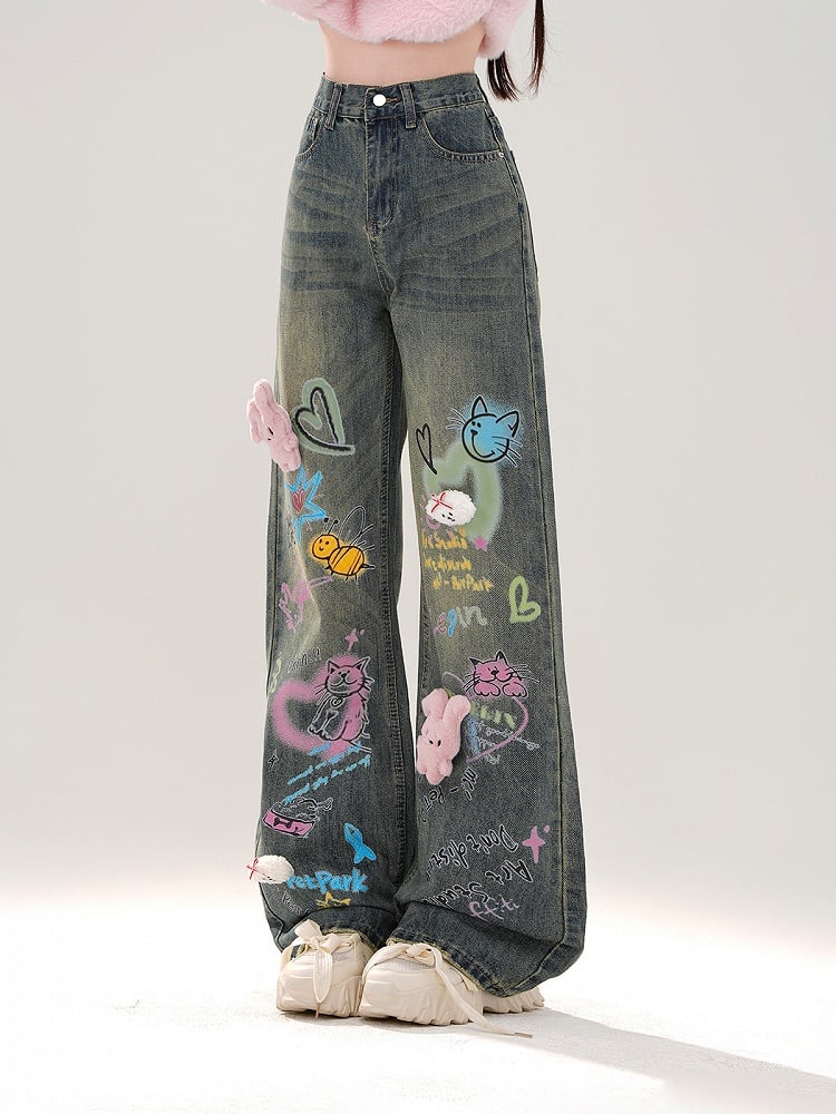 Jeans mit weitem Bein, buntem Graffiti und abnehmbarem rosa Plüschhasen in Blau