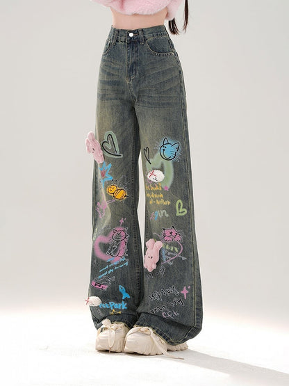 Jeans mit weitem Bein, buntem Graffiti und abnehmbarem rosa Plüschhasen in Blau