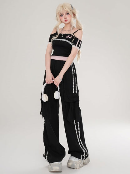 Hose mit floralen Schleifendetails und geradem Bein mit apricot/schwarzen Streifen und