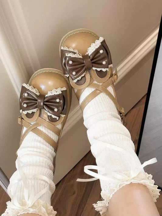 耳の上部に茶色の十字形装飾のビーズリボンのウサギのデザイン