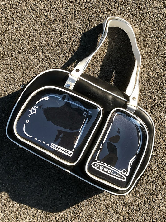 Brotförmige Ita-Umhängetasche in Schwarz-Weiß mit Kontrastbesatz