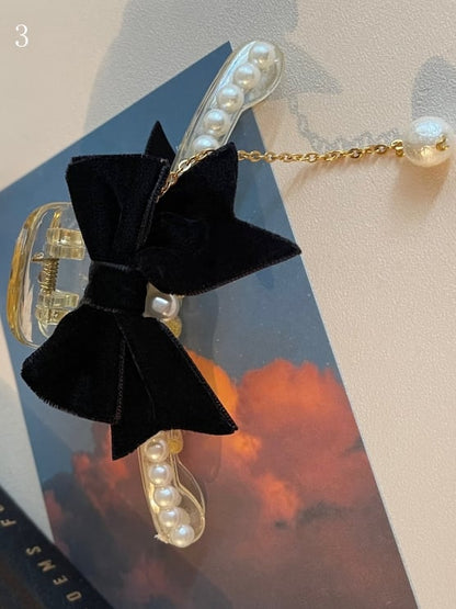 ビーズの蝶結びの黒い爪クリップ装飾