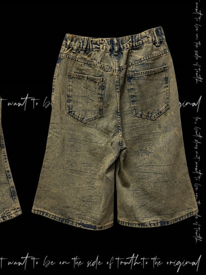 パンクなウェイストランドクロスのアップリケ、イエローのダメージ加工の穴あきデニムショーツ、Y2K