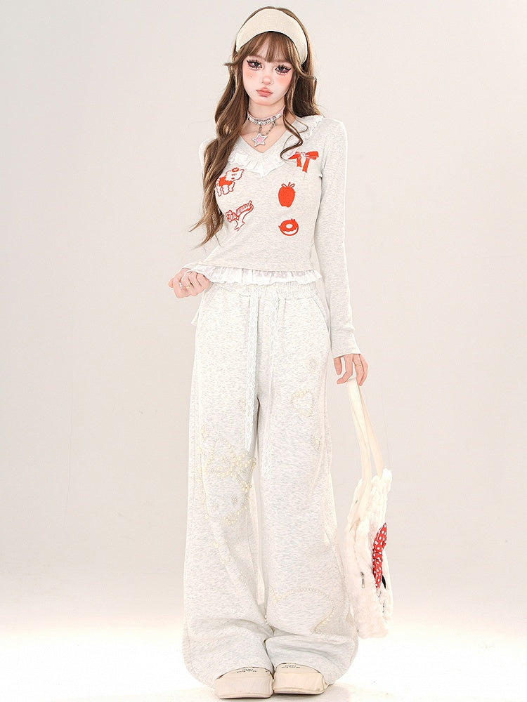 Schwarz/Graues Cartoon-Top mit V-Ausschnitt und Spitzenbesatz