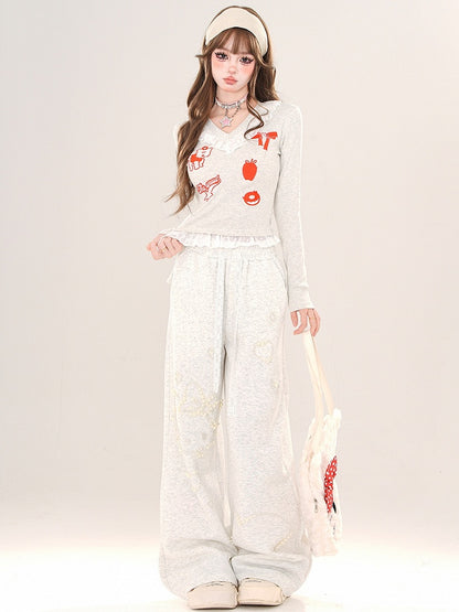 Schwarz/Graues Cartoon-Top mit V-Ausschnitt und Spitzenbesatz