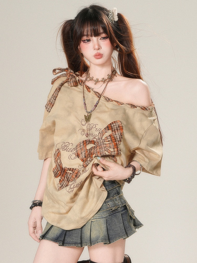 アップリケ付きブラウン/ホワイトのアシンメトリーなグラマラスTシャツ。チェック柄のバタフライ柄。ほろ苦いネックライン。