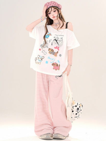 Weiß/Schwarzes lockeres T-Shirt mit asymmetrischem Ausschnitt und Cartoon-Welpen