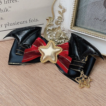 ハロウィンの装飾された蝶結びのコウモリ、黒、赤/緑の羽のヘアクリップ