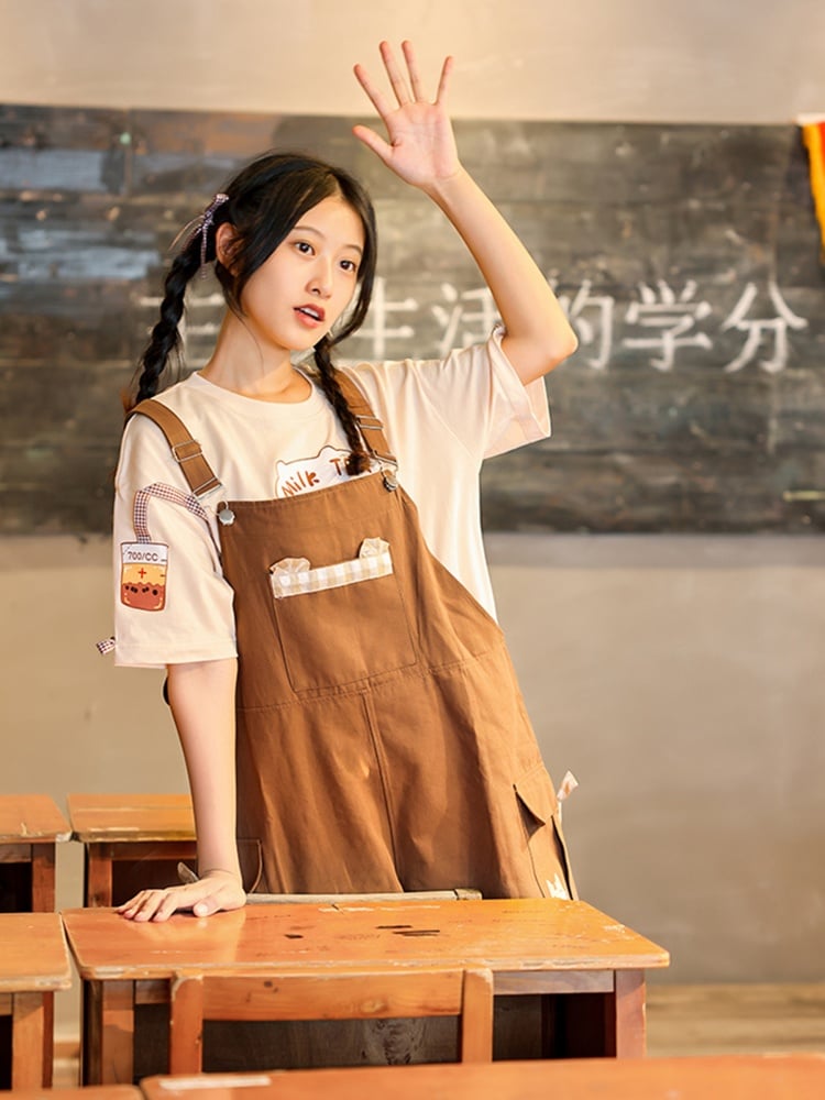 ブラウンのカーゴポケット付き蝶結びディテールのオーバーオールショーツ