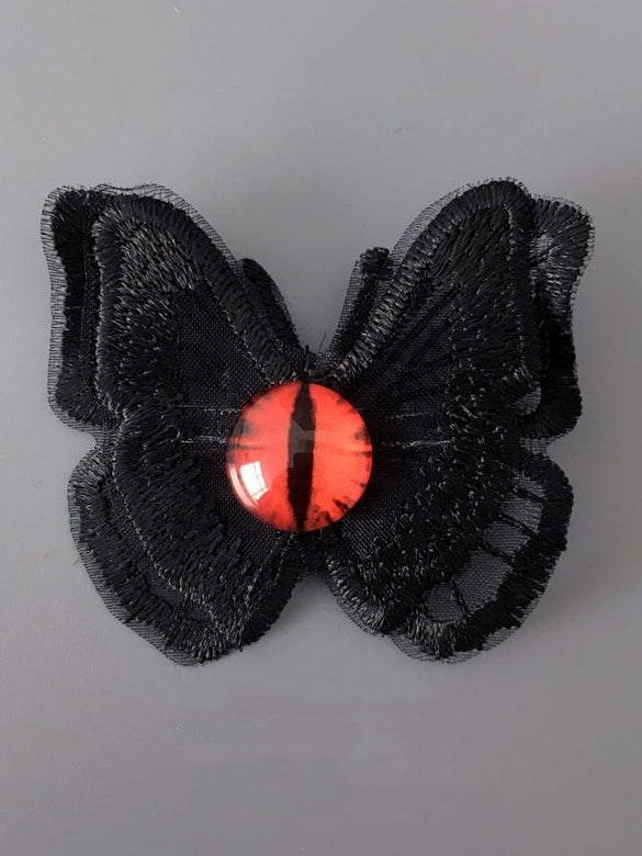 Gothic Haarspange mit rotem Auge und Schmetterling