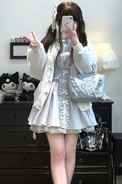 Strickjacke mit Spitzenschleife und losem Band