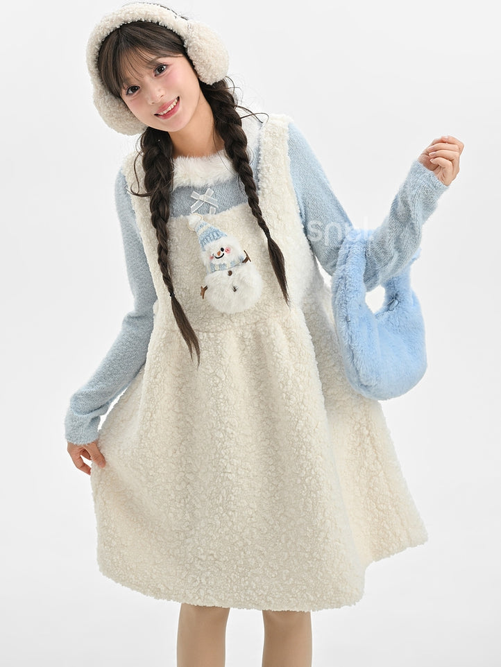 Blaues, langärmliges Oberteil mit Plüschbesatz am Ausschnitt und Schleifendetails