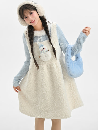 Blaues, langärmliges Oberteil mit Plüschbesatz am Ausschnitt und Schleifendetails