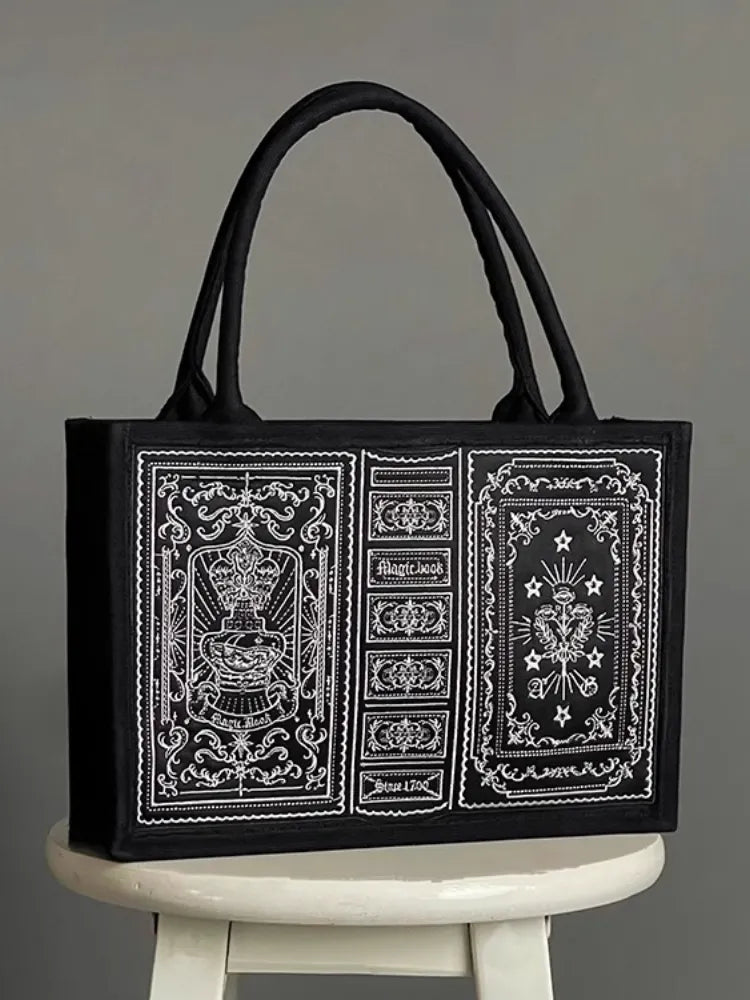 Schwarze Handtasche mit Stickerei „Magic Book“