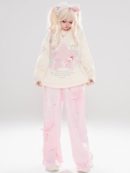 ライトブルー/ライトイエローの星のアップリケがキュートな猫ちゃんをあしらったゆったりセーター