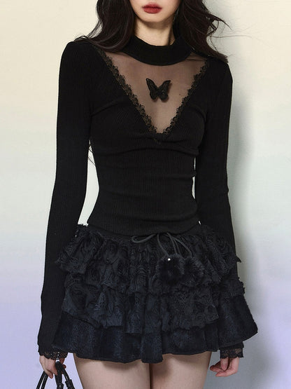 Schwarzes, langärmliges Top mit Illusionsausschnitt und Schmetterlingsakzenten