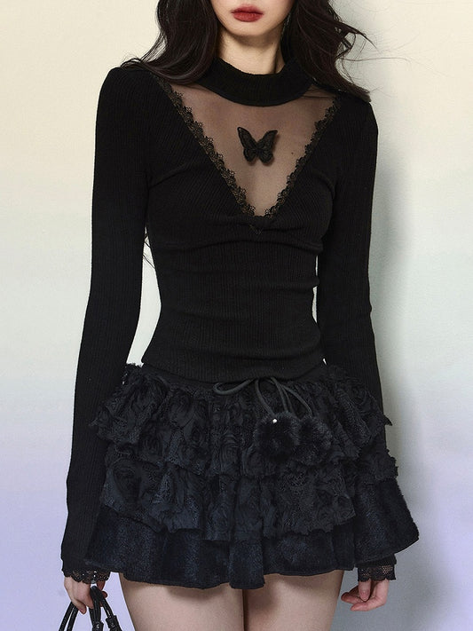 Schwarzes, langärmliges Top mit Illusionsausschnitt und Schmetterlingsakzenten